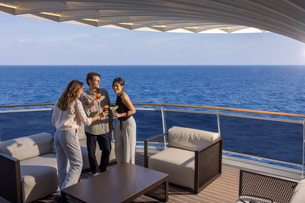 People with drinks onboard a MSC Cruise ship